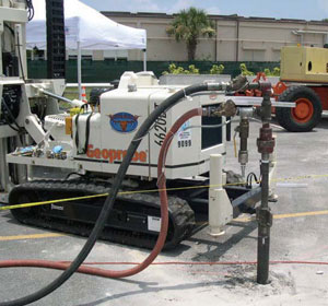 Pneumatic and product hoses attached to a 360�-rotatable injection nozzle on a direct push rig.